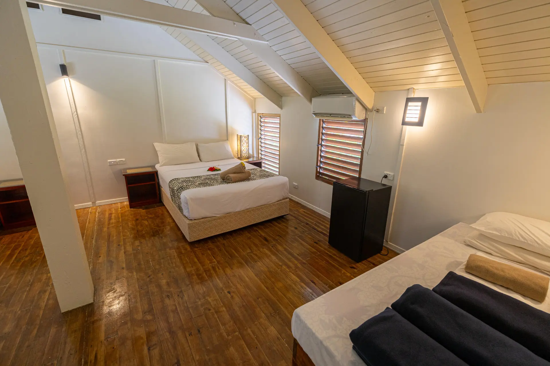 Loft bedroom with hardwood floors
